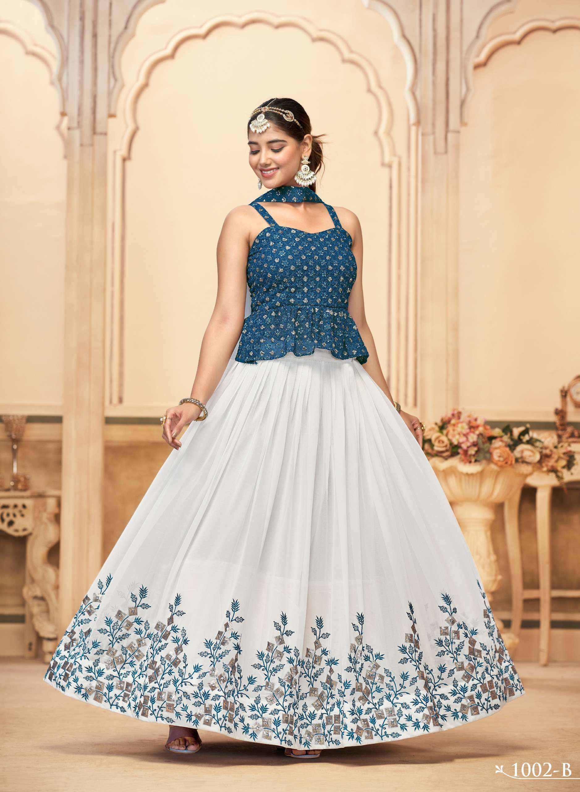 DESIGN NO. 1001 TO 1004 BY INDIAN WOMEN PURE GEORGETTE WITH HEAVY EMBROIDERY STYLISH LEHENGA BLOUSE & DUPATTA 