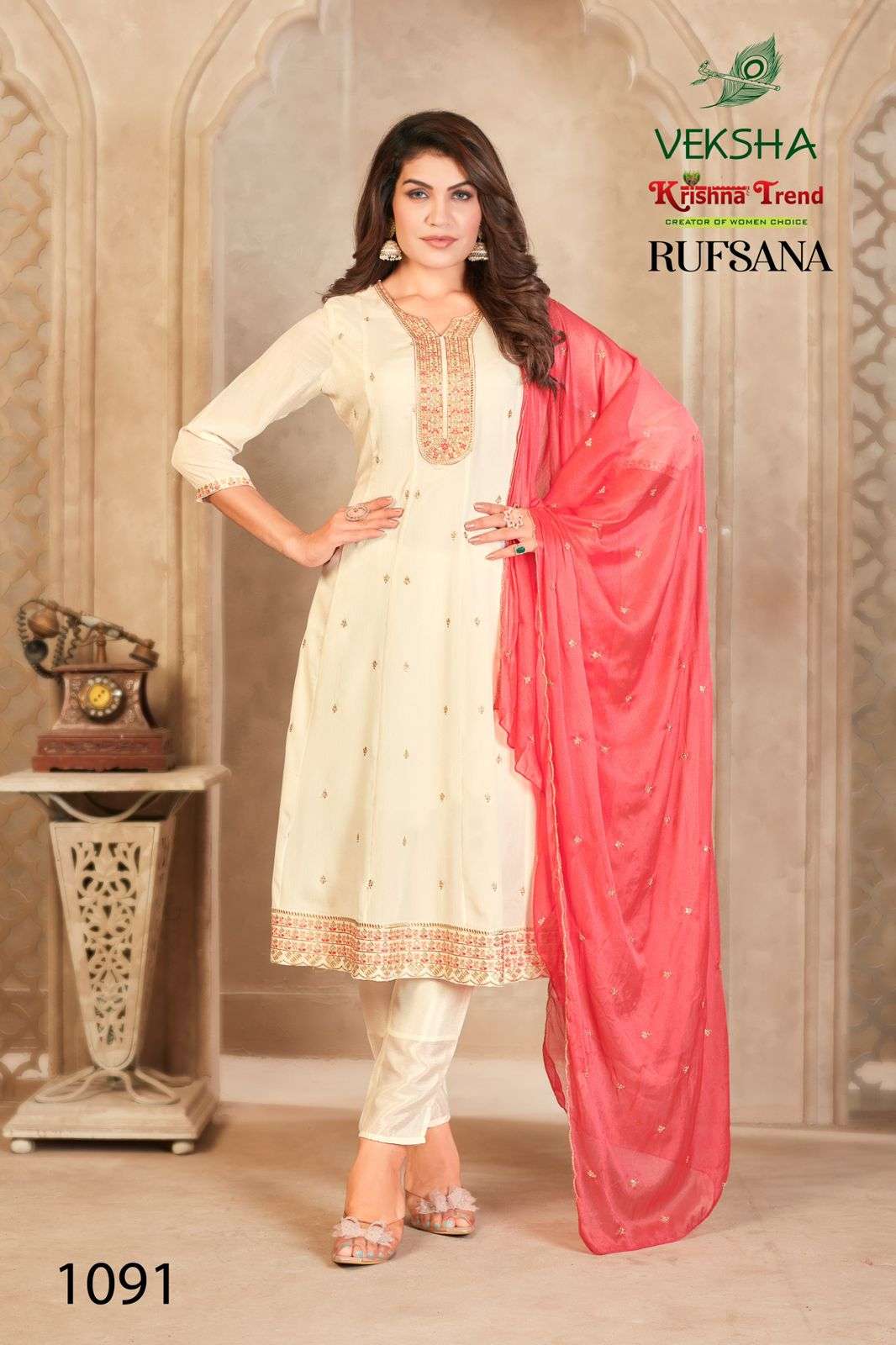 RUFSANA BY VEKSHA IN CHINNON DIED WITH INNER AND HEAVY EMBROIDERY WORK 