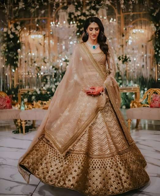 ANTIQUE GOLD BRIDAL LEHENGA WITH HEAVY EMBROIDERY AND NET DUPATTA